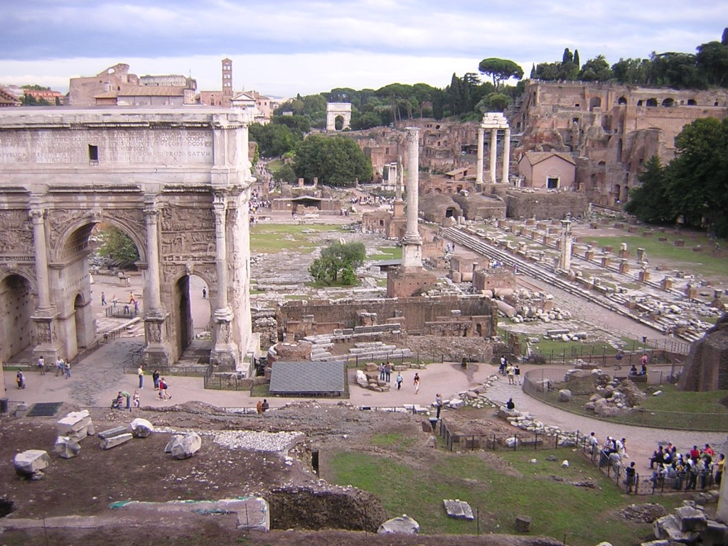 I am now standing on the Capitoline Hill, with the Temple of Jupiter behind me.  I am looking down the forum, and the Palatine hill, where the Imperial Palace was, is the high tree-lined crest to the right.
