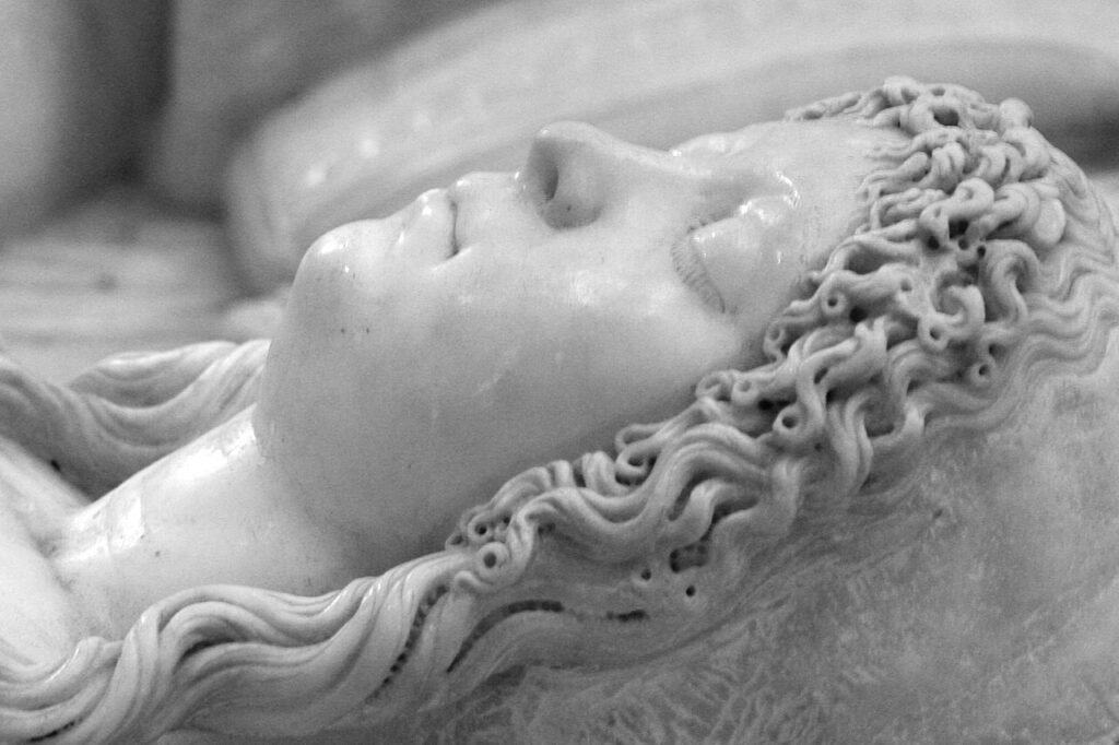 Detail of her face in profile in the carved tomb. She appears to be asleep, and the detail of her eyelashes in the marble is exquisite.