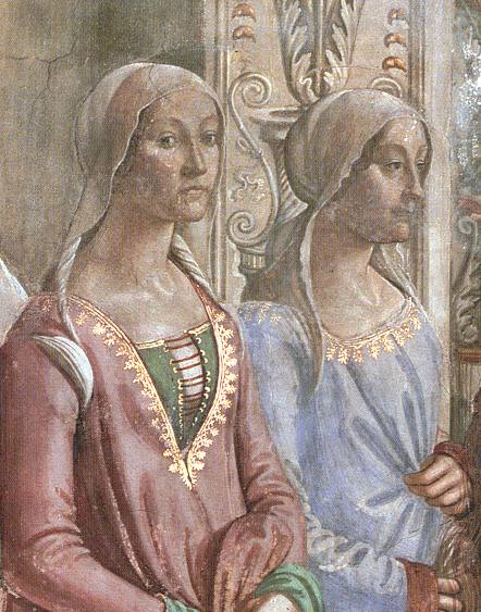 Fresco detail showing two of whom the left is Clarice Orsini. She wears a pink overgown edged in gold over a green underdress. Her head is covered by a translucent veil, looking very modest and almost like the poor women in the image of the men doing charity except for the detail of gold edging on her gown.