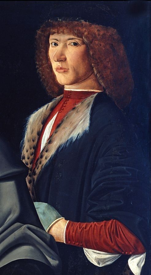 Portrait possibly of Galeazzo Sanseverino. A man with auburn shoulder - length curly hair stands looking at the viewer. He wears a black cap, a costly black velvet overgarment lined with leopard fur, a red doublet partly unbuttoned down the front, and gray gloves.