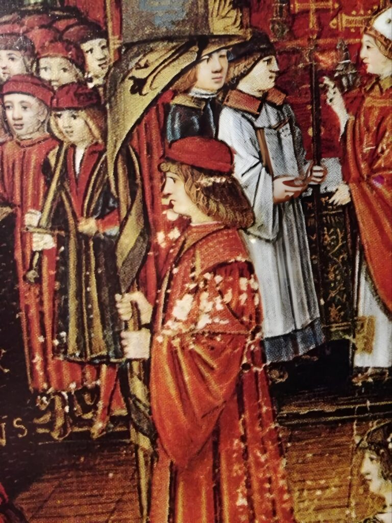 Miniature painting of Galeazzo Sanseverino in the midst of a procession in Milan. He wears red robes and a red cap, and carries a banner with the black eagle on gold of the emperor, which is part of the Sforza crest.