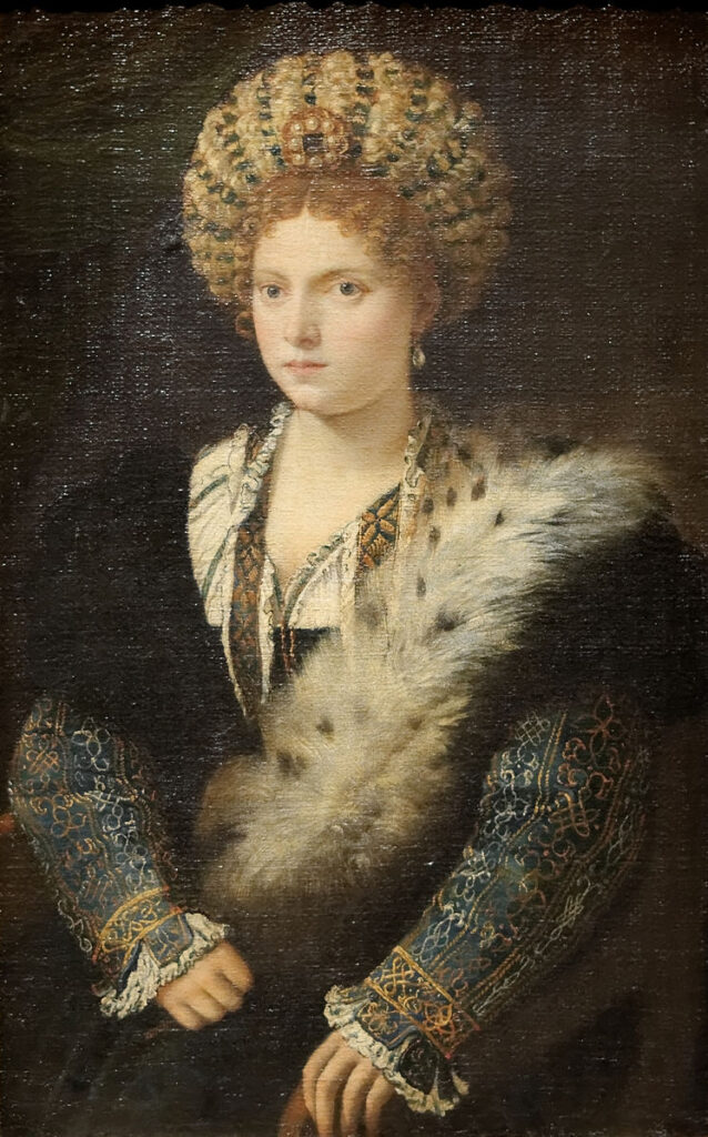 Isabella d'Este wearing a large turban like hat covered with ribbons, gold, and pearls. This is when she is Marquess of Mantua, married to Francesco Gonzaga.