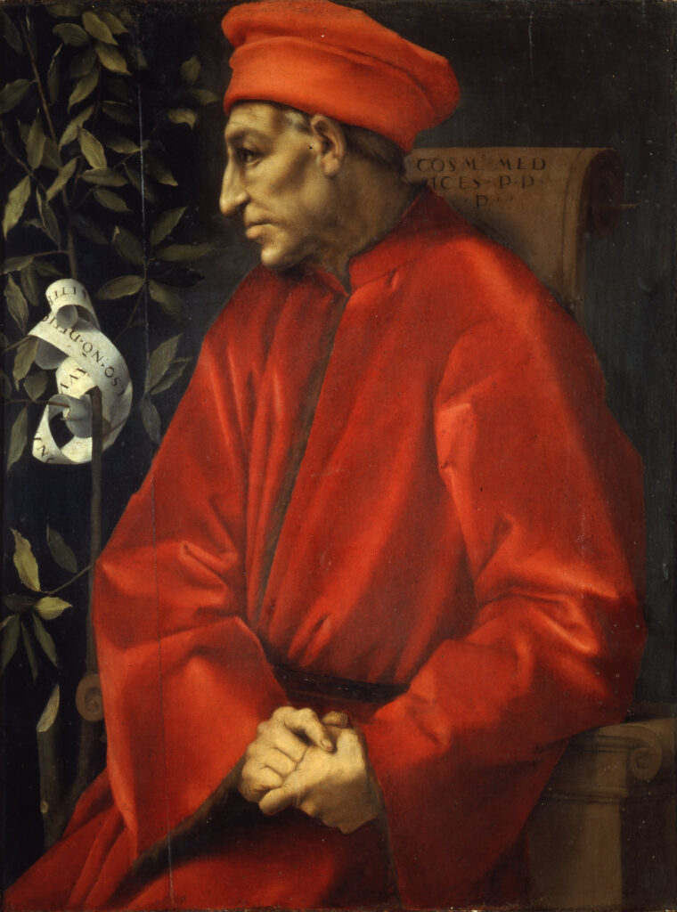 Portrait of Cosimo the Elder, wearing very expensive but humble - in - rank merchant's red robes and a merchant's red hat. He sits in a wooden chair. Next to him grows a laurel tree with a ribbon wrapped around it, repr e senting his noble descendants especially Lorenzo il Magnifico, his grandson.